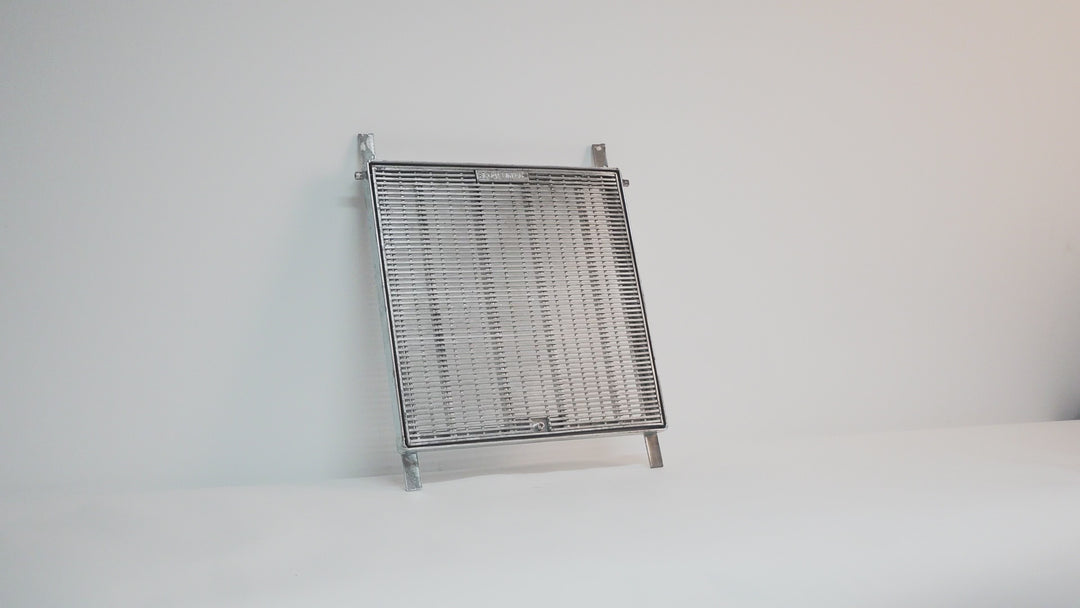 Galvanised steel heelguard pit grate with anti-slip wedge wire design. Allows high water flow while preventing debris entry and heel penetration. Ideal for pedestrian areas, driveways, and commercial drainage pits.